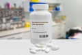 Bottle of generic Remdesivir Antiviral tablets 200 mg over blurry laboratory background. artistic rendering. Generic barcode Royalty Free Stock Photo