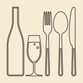 Bottle, glass of champagne, fork, knife and spoon Royalty Free Stock Photo