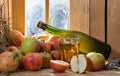 Bottle and glass of cider with apples Royalty Free Stock Photo