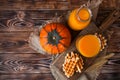Bottle and Glass of healhty fresh pumpkin juice with wafer and p Royalty Free Stock Photo