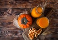 Bottle and Glass of healhty fresh pumpkin juice with wafer and p Royalty Free Stock Photo