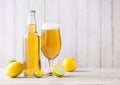 Bottle and glass of lager beer with lemon and lime Royalty Free Stock Photo