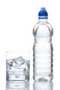Bottle and glass of mineral water with droplets Royalty Free Stock Photo