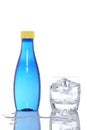 Bottle and glass of mineral water with droplets Royalty Free Stock Photo