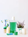 Bottle and glass of mouthwash on bath shelf with toothbrush. Dental oral hygiene concept. Set of oral care products Royalty Free Stock Photo