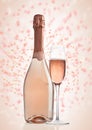 Bottle and glass of pink rose champagne on pink Royalty Free Stock Photo