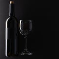 Bottle and glass with red wine on dark grey background. Space for text. Horizontal format. Template concept for your design and Royalty Free Stock Photo