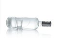 Bottle and glass of vodka lying isolated on white background Royalty Free Stock Photo