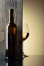 Bottle and glass of white wine on a black table Royalty Free Stock Photo