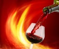 bottle and a glass of wine on the background of fire Royalty Free Stock Photo