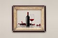 Bottle and glass of wine in the frame on the wall Royalty Free Stock Photo