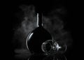 Bottle and glass of wine in smoke Royalty Free Stock Photo