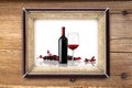 Bottle and glass of wine on wooden backgrounds Royalty Free Stock Photo