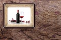 Bottle and glass of wine on wooden backgrounds