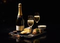 Bottle and glasses of luxury champagne on black stone board with cheese.Macro.AI Generative