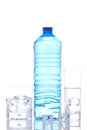 Bottle and glasses of mineral water with ice cubes Royalty Free Stock Photo