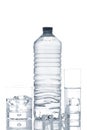 Bottle and glasses of mineral water with ice cubes Royalty Free Stock Photo