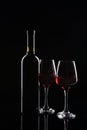 Bottle and glasses of red wine on dark background Royalty Free Stock Photo