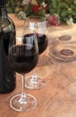 Bottle & Glasses of Red Wine on Outdoor Table Royalty Free Stock Photo