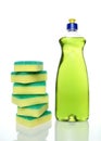 Bottle of green dishwashing liquid and sponges Royalty Free Stock Photo