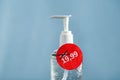 Bottle of hand disinfecting gel, hand sanitizer with price changed to much higher than before. Dramatic raise of hand hygiene prod