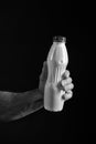 Bottle with healthy drink or yoghurt in hand of man Royalty Free Stock Photo