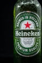 Selinsgrove, Pennsylvania - March 18, 2019: A bottle of Heineken beer isolated against a black background.