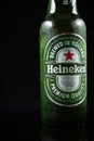 Selinsgrove, Pennsylvania - March 18, 2019: A bottle of Heineken beer isolated against a black background.