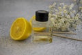 Bottle of home  domestic  orange, fragrance  product  wellness  gypsophila flower decorationessence Royalty Free Stock Photo