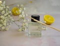 Bottle of home fragrance orange, wellness  gypsophila flower decorationessence Royalty Free Stock Photo