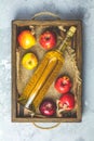 Bottle of homemade organic apple cider with apples in box Royalty Free Stock Photo