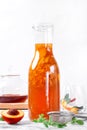 Bottle of iced tea with nectarine, peach and lemon Royalty Free Stock Photo