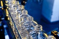 Bottle. Industrial production of plastic pet bottles. Factory line for manufacturing polyethylene bottles. Transparent food packag Royalty Free Stock Photo