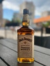 Bottle of Jack Daniels Tennessee Whisky placed on top of a rustic wooden table Royalty Free Stock Photo