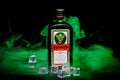 A bottle of Jagermeister, a German digestif made from 56 herbs and spices, the flagship product of Mast-Jagermeister SE, on a blac Royalty Free Stock Photo