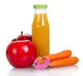 Bottle of juice, apples, carrots and dummy isolated on white. Royalty Free Stock Photo