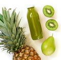 Bottle of kiwi, pineapple, pear juice isolated on white and ingredients. Royalty Free Stock Photo