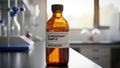 Bottle labeled UV Resistant Sample Batch 12345 on a laboratory Royalty Free Stock Photo