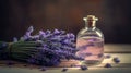 a bottle of lavender oil next to a bunch of lavender flowers on a table top with a corked corker on the top of the bottle Royalty Free Stock Photo