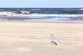 Bottle with letter on a beach, shallow depth of field Royalty Free Stock Photo