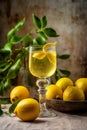 A bottle of limoncello and lemon on light rustic background. Lemon liqueur.