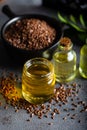 Bottle of linseed oil and linseeds in bowl. Royalty Free Stock Photo