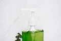 Bottle of liquid soap. The bottle is green and clear, and the soap is in a pump dispenser Royalty Free Stock Photo