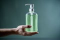 A bottle of liquid soap in hand Royalty Free Stock Photo