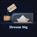 Bottle, little paper ship and inspiring lettering Dream big