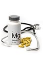 Bottle of Magnesium vitamins with stethoscope Royalty Free Stock Photo