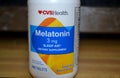 Bottle of Melatonin Closeup. Sleep Aid. Dietary Supplement.