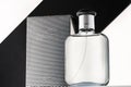 a bottle of men\'s cologne or eau de toilette on a black and white background  strict style  copy space mockup Royalty Free Stock Photo