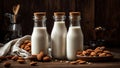 Bottle with milk, almonds on old background tasty kitchen refreshment