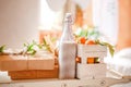 Bottle of milk and box with tangerines on the bed Royalty Free Stock Photo